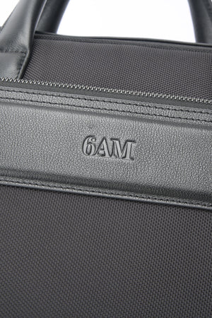 Geantă neagră pentru laptop din piele și material textil