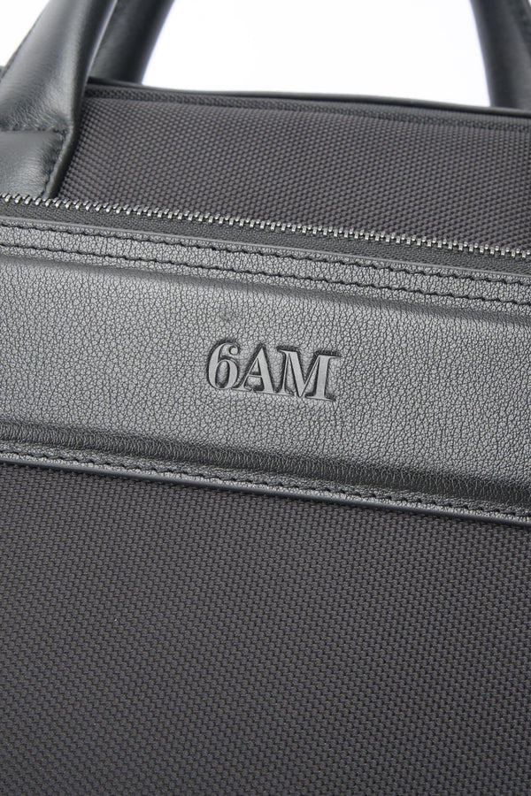 Geantă neagră pentru laptop din piele și material textil